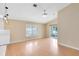 Spacious living room with wood floors and large windows at 139 Andrews Rd, Sanford, FL 32773