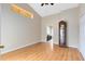 Bright living room with wood laminate floors, grand father clock and view of the kitchen at 139 Andrews Rd, Sanford, FL 32773