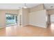 Bright living room featuring high ceilings, wood floors, and sliding doors with beautiful lake views at 139 Andrews Rd, Sanford, FL 32773