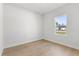 Bright bedroom features wood-look floors and a large window for natural light at 14915 Sw 39Th Cir, Ocala, FL 34473
