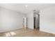 Bright bedroom with wood floors and a doorway leading to other rooms in the home at 14915 Sw 39Th Cir, Ocala, FL 34473
