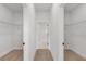 Walk-in closet featuring modern wire shelving and light wood floors, creating an organized storage space at 14915 Sw 39Th Cir, Ocala, FL 34473