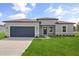 Charming single-story home featuring a well-manicured lawn and a two-car garage, perfect for Gathering living at 14915 Sw 39Th Cir, Ocala, FL 34473