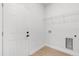Utility room with new washer and dryer hookups, and interior access door at 14915 Sw 39Th Cir, Ocala, FL 34473