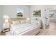Bright main bedroom featuring neutral tones, light wood floors, and ample natural light from a window at 14915 Sw 39Th Cir, Ocala, FL 34473
