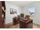 Office featuring a large desk, bookshelf, and window with a view at 14915 Sw 39Th Cir, Ocala, FL 34473