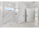 Beautiful walk-in shower with white tile and modern fixtures, designed for comfort and style at 14915 Sw 39Th Cir, Ocala, FL 34473