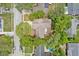 Aerial view of a home with mature trees and backyard pool at 1514 Sparrow St, Longwood, FL 32750