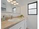 Bathroom featuring a vanity with storage, a sink, and a window at 1514 Sparrow St, Longwood, FL 32750