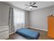 Cozy bedroom with wood floors and light gray walls for a tranquil retreat at 1514 Sparrow St, Longwood, FL 32750