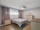 Bedroom with neutral walls, wood floors, and windows with ample light at 1514 Sparrow St, Longwood, FL 32750