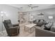 Comfortable living room featuring a neutral color palette, wood floors, and an adjacent dining area at 1514 Sparrow St, Longwood, FL 32750