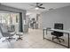 Open living space with comfortable seating and view into kitchen and outside to patio at 1514 Sparrow St, Longwood, FL 32750