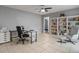 Bright office space with desk, bookshelves, and comfortable seating area at 1514 Sparrow St, Longwood, FL 32750