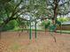 Community playground equipment with wood chip base at 1514 Sparrow St, Longwood, FL 32750