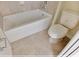 Bathroom showcasing a bathtub and toilet at 16129 Palm Frond Ave, Clermont, FL 34714