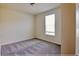 Bedroom with neutral carpet and a window at 16129 Palm Frond Ave, Clermont, FL 34714