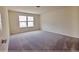 Comfortable bedroom with plush carpet and a bright window, offering a serene space at 16129 Palm Frond Ave, Clermont, FL 34714