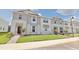 Attractive townhome community featuring well-manicured lawns and modern architectural design at 16129 Palm Frond Ave, Clermont, FL 34714