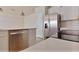 Kitchen featuring stainless steel appliances and a large refrigerator at 16129 Palm Frond Ave, Clermont, FL 34714