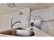 Modern kitchen featuring stainless steel appliances and a quartz countertop at 16129 Palm Frond Ave, Clermont, FL 34714