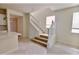 Staircase with white railing and wood steps, leading to the second floor at 16129 Palm Frond Ave, Clermont, FL 34714