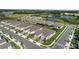 An aerial shot capturing a neighborhood with homes featuring pools, landscaping, and well-maintained lawns at 1650 Key Bay Trl, Kissimmee, FL 34747