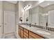 Bathroom featuring double sinks with granite countertops and modern fixtures, offering both style and functionality at 1650 Key Bay Trl, Kissimmee, FL 34747