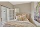 Cozy bedroom featuring a comfortable bed, warm textures, and modern decor at 1650 Key Bay Trl, Kissimmee, FL 34747