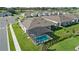 Aerial view of a screened-in pool and backyard, surrounded by well-maintained landscaping and green lawn at 1650 Key Bay Trl, Kissimmee, FL 34747