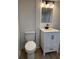 Bright bathroom features a white vanity, contemporary fixtures, and a modern toilet at 2035 Voltaire St, Lakeland, FL 33801
