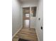 Hallway with updated floors and neutral paint at 2035 Voltaire St, Lakeland, FL 33801