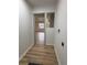 Hallway with updated floors and neutral paint at 2035 Voltaire St, Lakeland, FL 33801