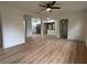Spacious living room features open access to the updated kitchen, modern flooring, and natural light at 2035 Voltaire St, Lakeland, FL 33801