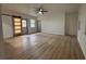 Living room with updated floors, a barn door, neutral paint, and a ceiling fan at 2035 Voltaire St, Lakeland, FL 33801