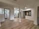 Bright living area with modern floors and paint, offering an open view of the newly remodeled kitchen at 2035 Voltaire St, Lakeland, FL 33801