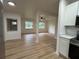 Inviting living space, revealing an updated kitchen with modern appliances, countertops, and plenty of natural light at 2035 Voltaire St, Lakeland, FL 33801