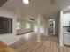 Bright living room featuring updated floors, neutral paint, and a ceiling fan at 2035 Voltaire St, Lakeland, FL 33801