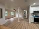 Spacious living room featuring updated floors, neutral paint, and an abundance of natural light at 2035 Voltaire St, Lakeland, FL 33801