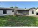 The yard, which includes landscaping, is a beautiful outdoor addition to this home at 2085 San Jose Blvd, Orlando, FL 32808