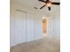 Inviting bedroom features a ceiling fan, a large window, and a spacious closet at 223 Monterey St, Kissimmee, FL 34759