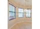 Well-lit dining area with tiled floor, chandelier, and three large windows at 223 Monterey St, Kissimmee, FL 34759
