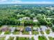 Beautiful aerial view of a single-Gathering home surrounded by mature trees and lush greenery at 229 Marcum Trace Dr, Lakeland, FL 33809