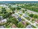 An aerial view of a quiet neighborhood with mature trees and well-maintained homes at 229 Marcum Trace Dr, Lakeland, FL 33809