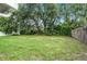 Large backyard with mature trees, offering privacy and plenty of space for outdoor enjoyment at 229 Marcum Trace Dr, Lakeland, FL 33809