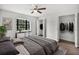 Serene bedroom with neutral tones features a comfy bed, bright window nook, and ample closet space at 229 Marcum Trace Dr, Lakeland, FL 33809