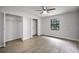 Spacious bedroom with lots of natural light, wood-look flooring, and multiple closets at 229 Marcum Trace Dr, Lakeland, FL 33809
