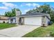 Charming stone-accented home with a spacious garage and well-kept front lawn at 229 Marcum Trace Dr, Lakeland, FL 33809