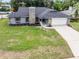 Charming single Gathering home with stone accents and a well-maintained lawn and two car garage at 229 Marcum Trace Dr, Lakeland, FL 33809