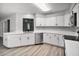 Modern, all-white kitchen with ample counter space and a sleek design at 229 Marcum Trace Dr, Lakeland, FL 33809